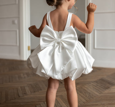 Back view of the Bella bow Dress showing oversized bow detail.