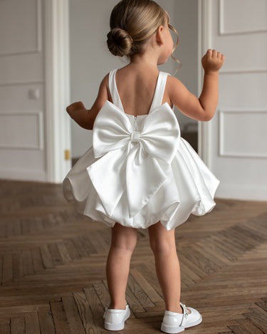 Back view of the Bella bow Dress showing oversized bow detail.