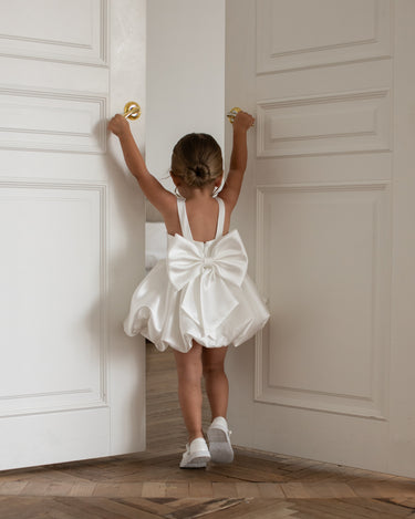 Close up of the Bella Bow dress fabric detailing