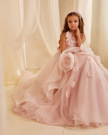 Child in luxury pink tulle flower girl gown