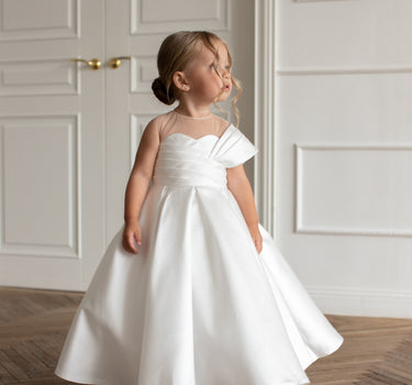 Little girl wearing the Elise gown, font view, white mikado flower girl dress.