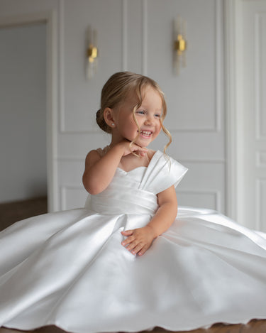 One shoulder drape detail on the Elise mikado flower girl gown