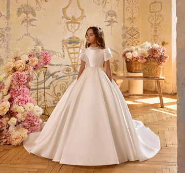 Full length view of girl wearing Isabella gown with puff sleeves front view