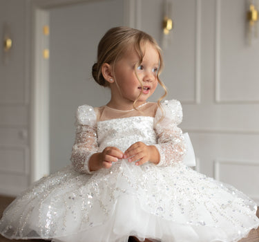 Side angle of the luna sequin dress showing oversized bow detail