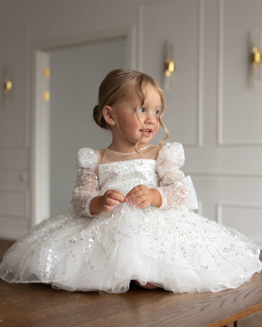 Side angle of the luna sequin dress showing oversized bow detail