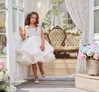 Full length front view of girl wearing the Elara Dress outdoors in natural light