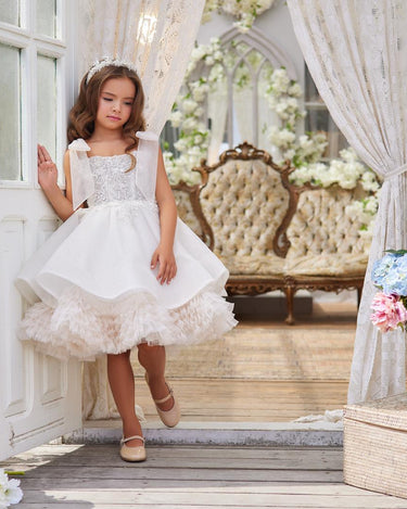 Full length front view of girl wearing the Elara Dress outdoors in natural light