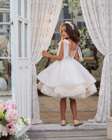 Full length back view of the elara Dress with sheer back and statement bows