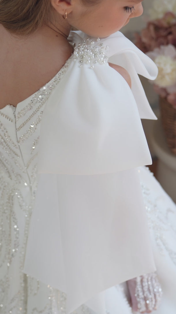 Video showing one shoulder sparkling gown with full train and intricate beading