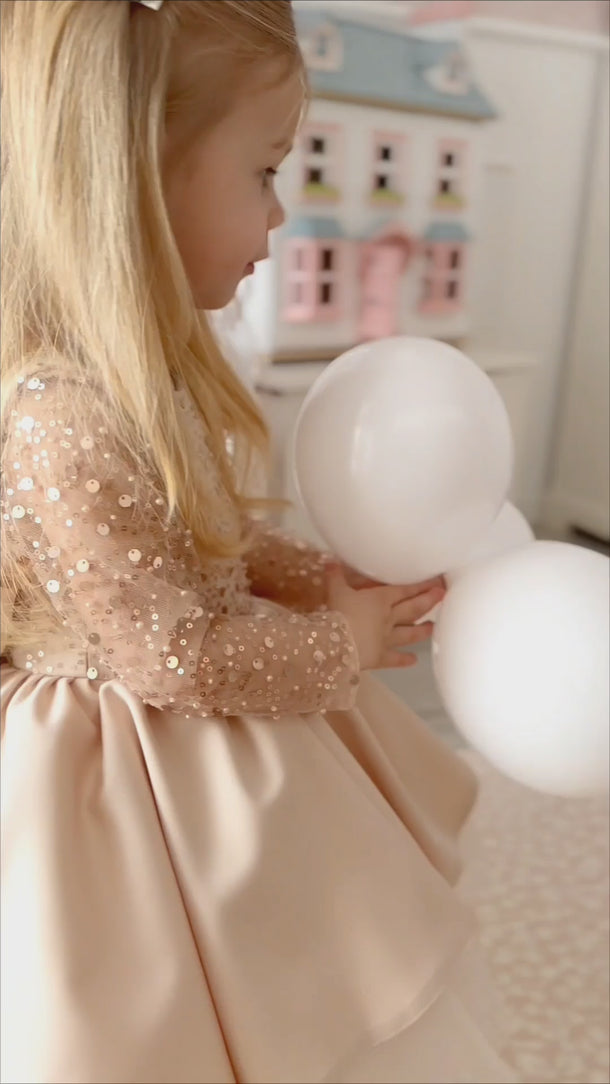 Full length view of Isla Belle Dress in soft blush tones